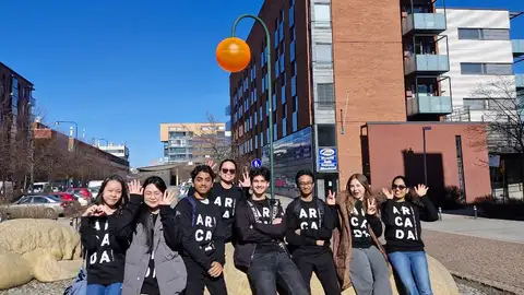 Group of student ambassadors smiling in the sun